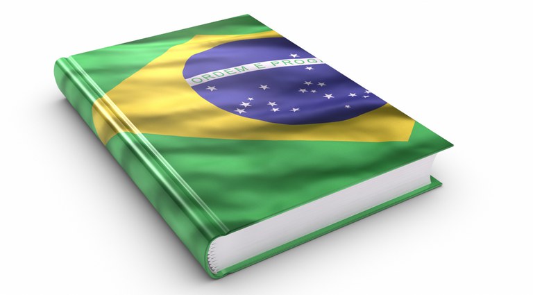 Ilustração de um livro com a bandeira do Brasil sendo a capa